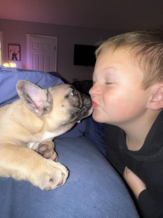 Liam and his puppy share the sweetest kiss